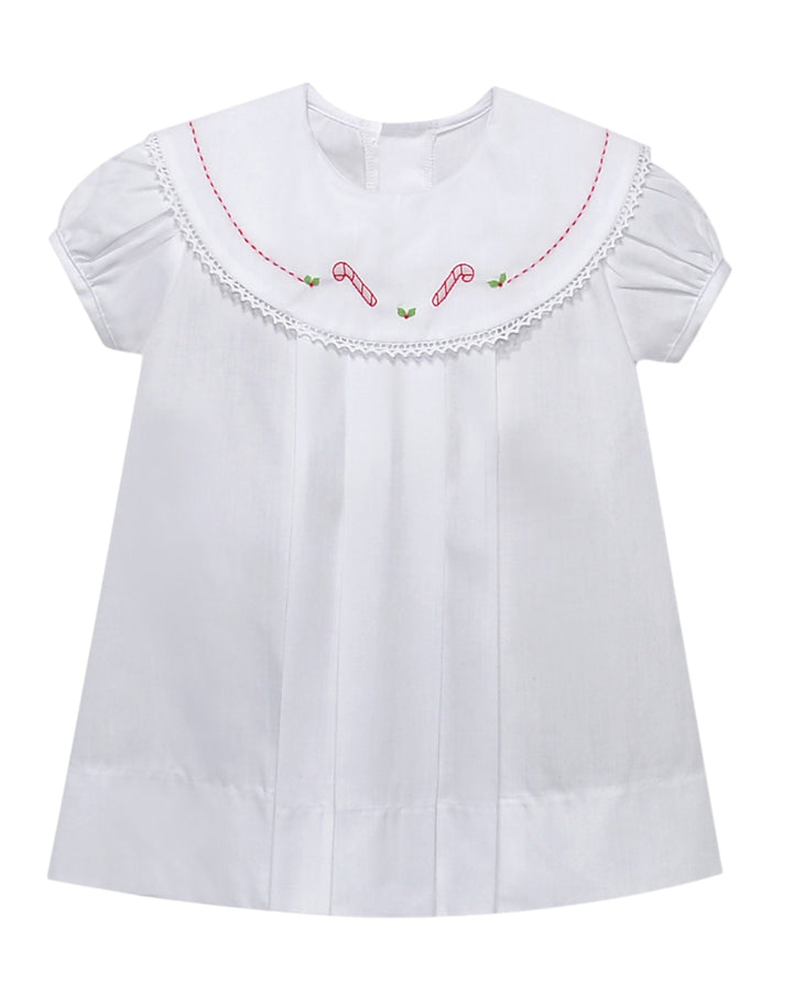 White blouse with red and green embroidery on a white background