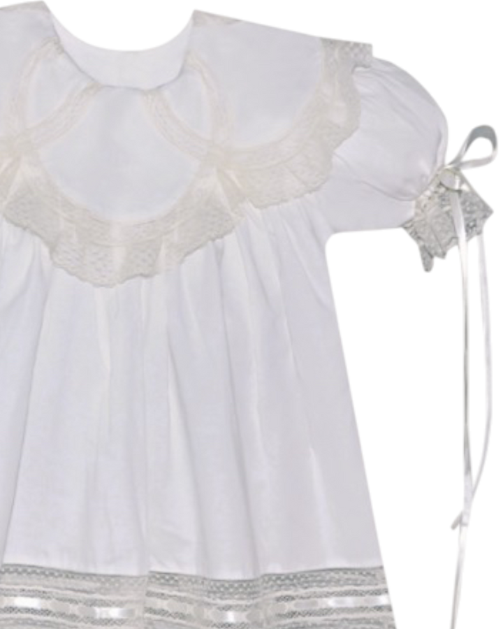 White dress with lace details on a white background