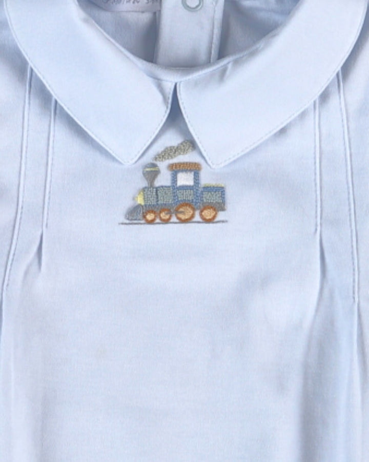 White shirt with a embroidered train design on the collar
