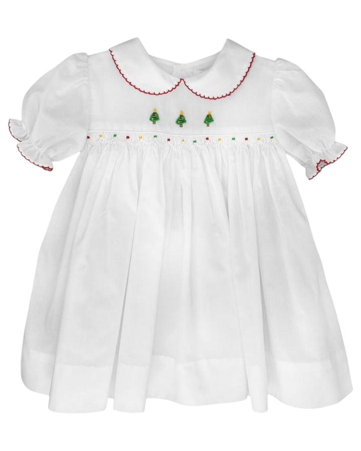 White dress with embroidered Christmas trees on a white background