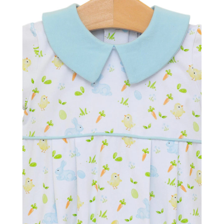 Baby bib with a light blue collar and animal pattern on a hanger