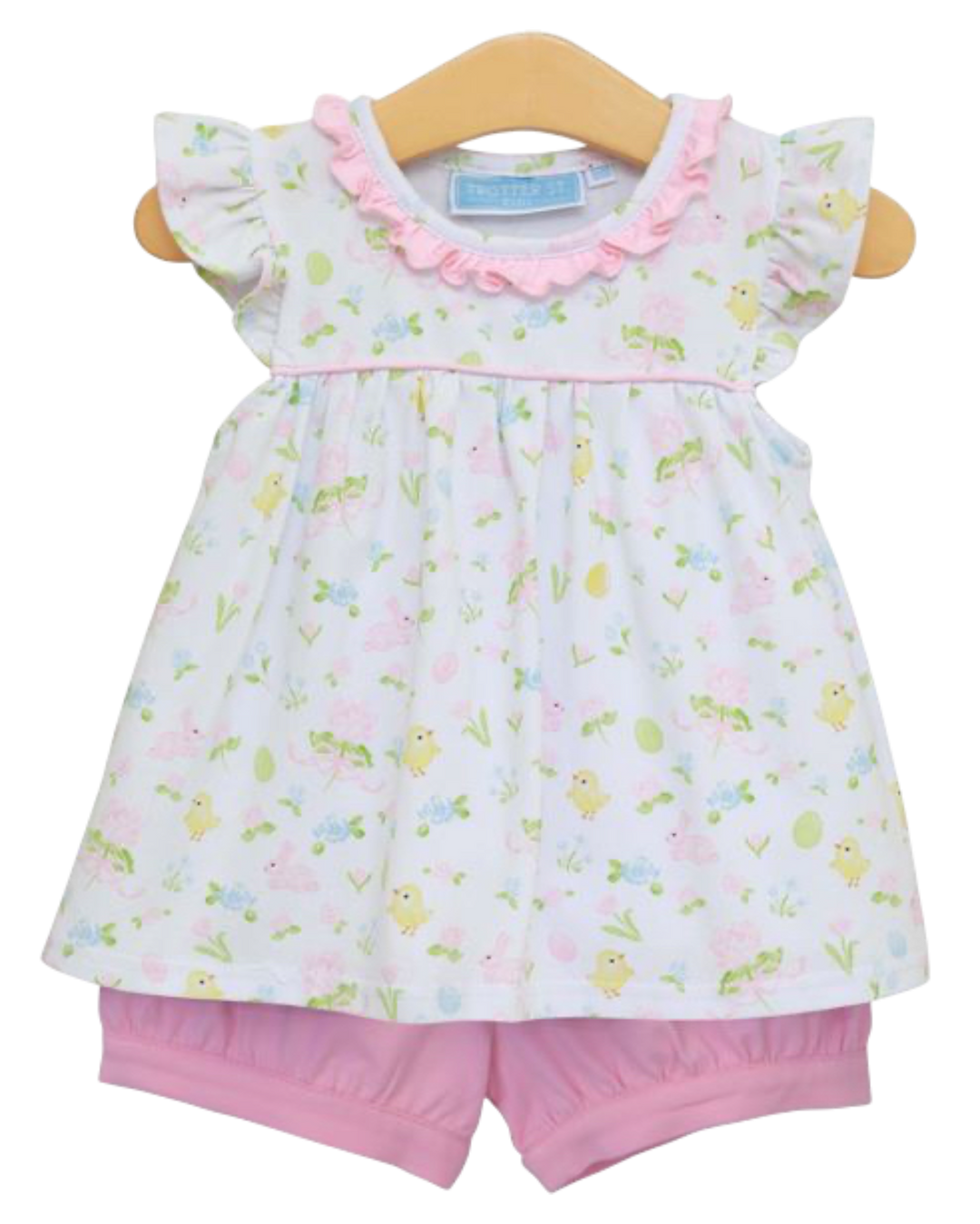 Baby girl's outfit with floral top and pink shorts on a hanger