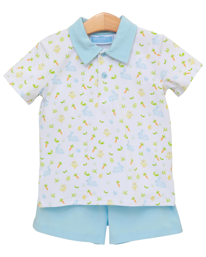 Children's outfit with patterned shirt and shorts on a white background