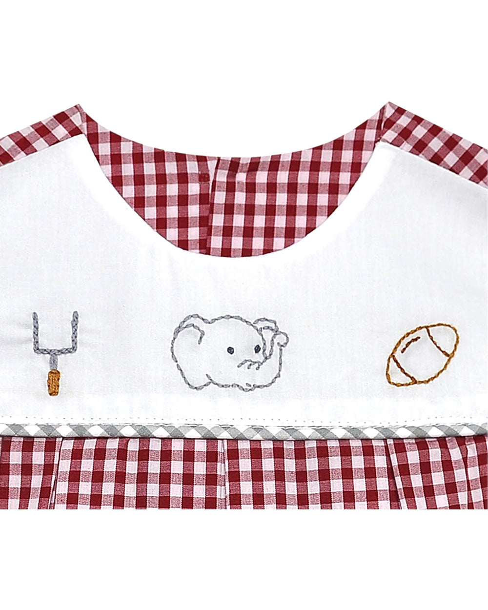 Children's apron with checkered trim and embroidered designs on a white background