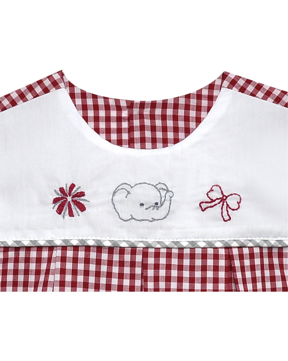 Embroidered bib with checkered red and white trim on a white background