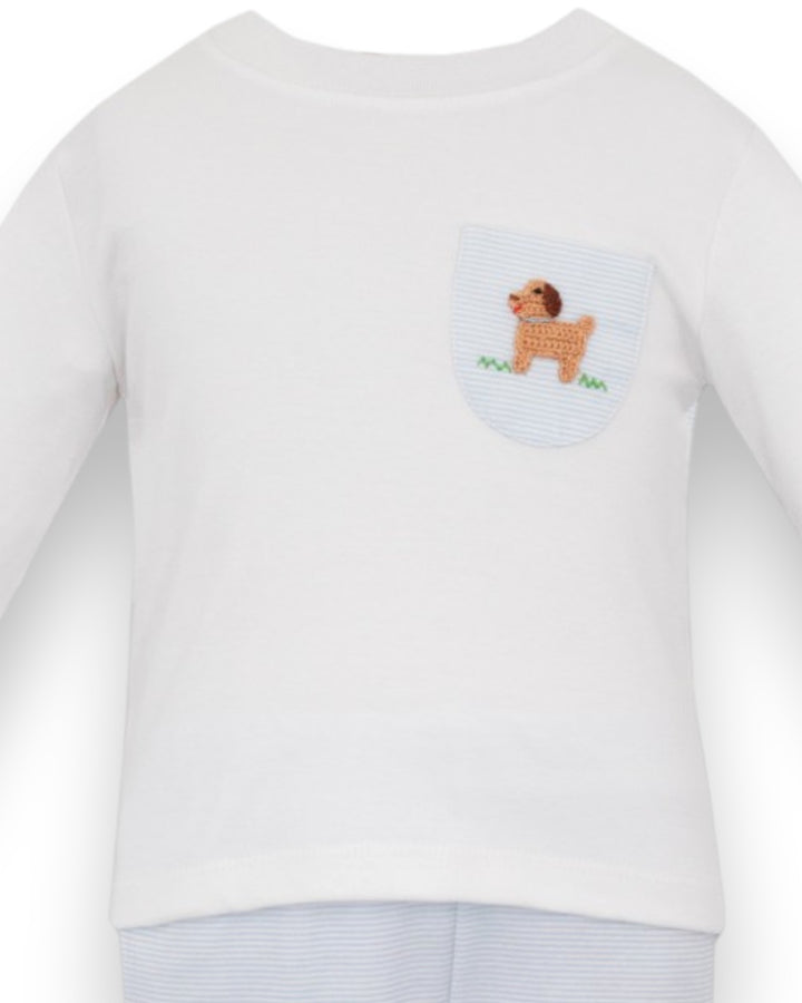 A white long-sleeve baby t-shirt featuring a small front chest pocket with a light blue and white striped background and a brown embroidered dog design, that store
