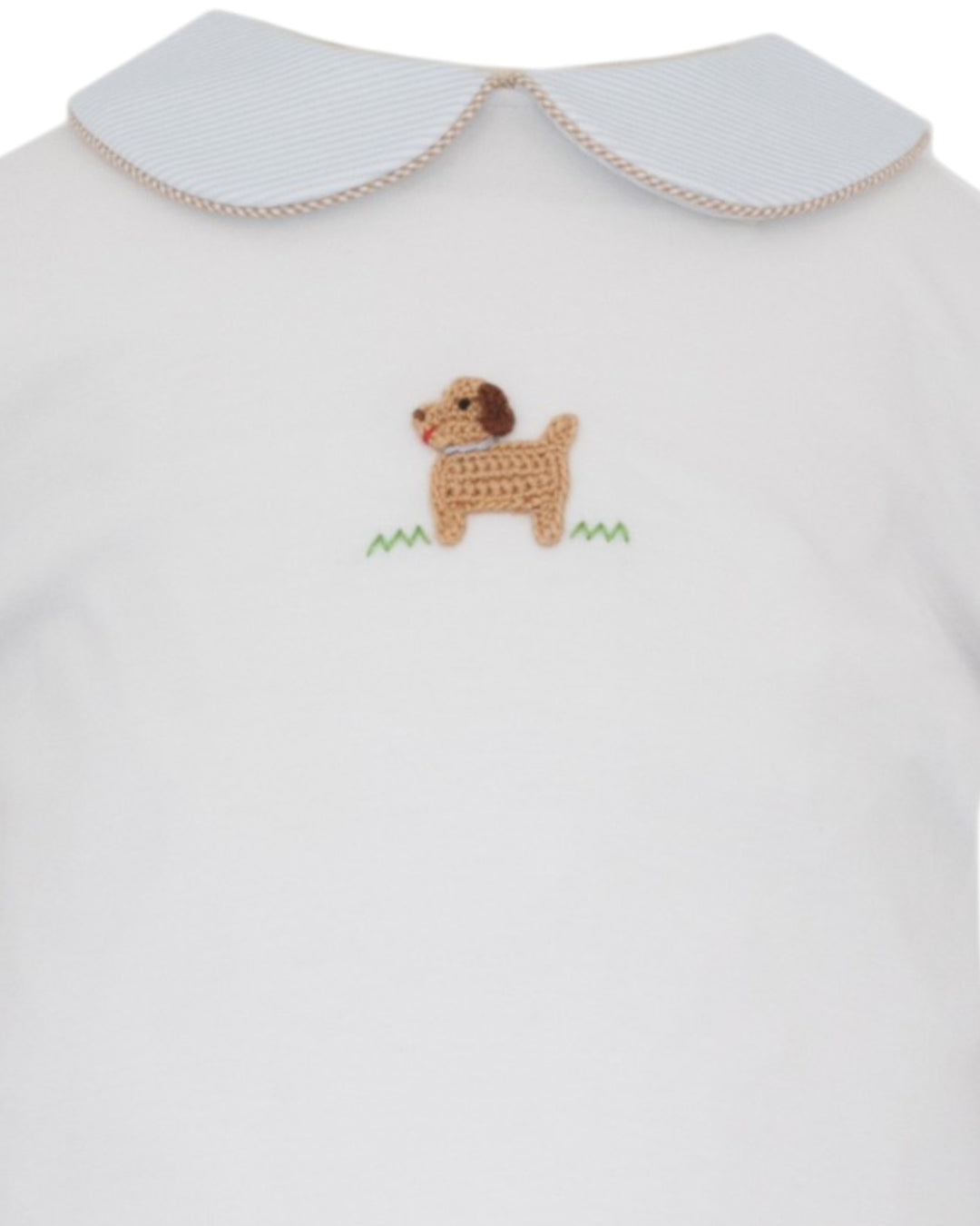 White baby bodysuit featuring a white striped Peter Pan collar with a beige trim and a crocheted dog patch on the chest, that store
