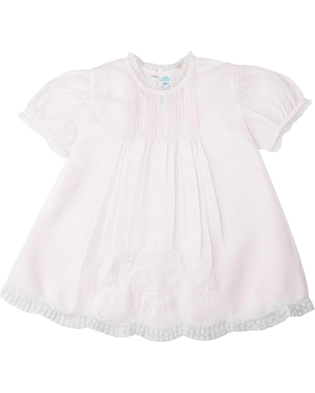 Light pink baby dress with short sleeves on a white background