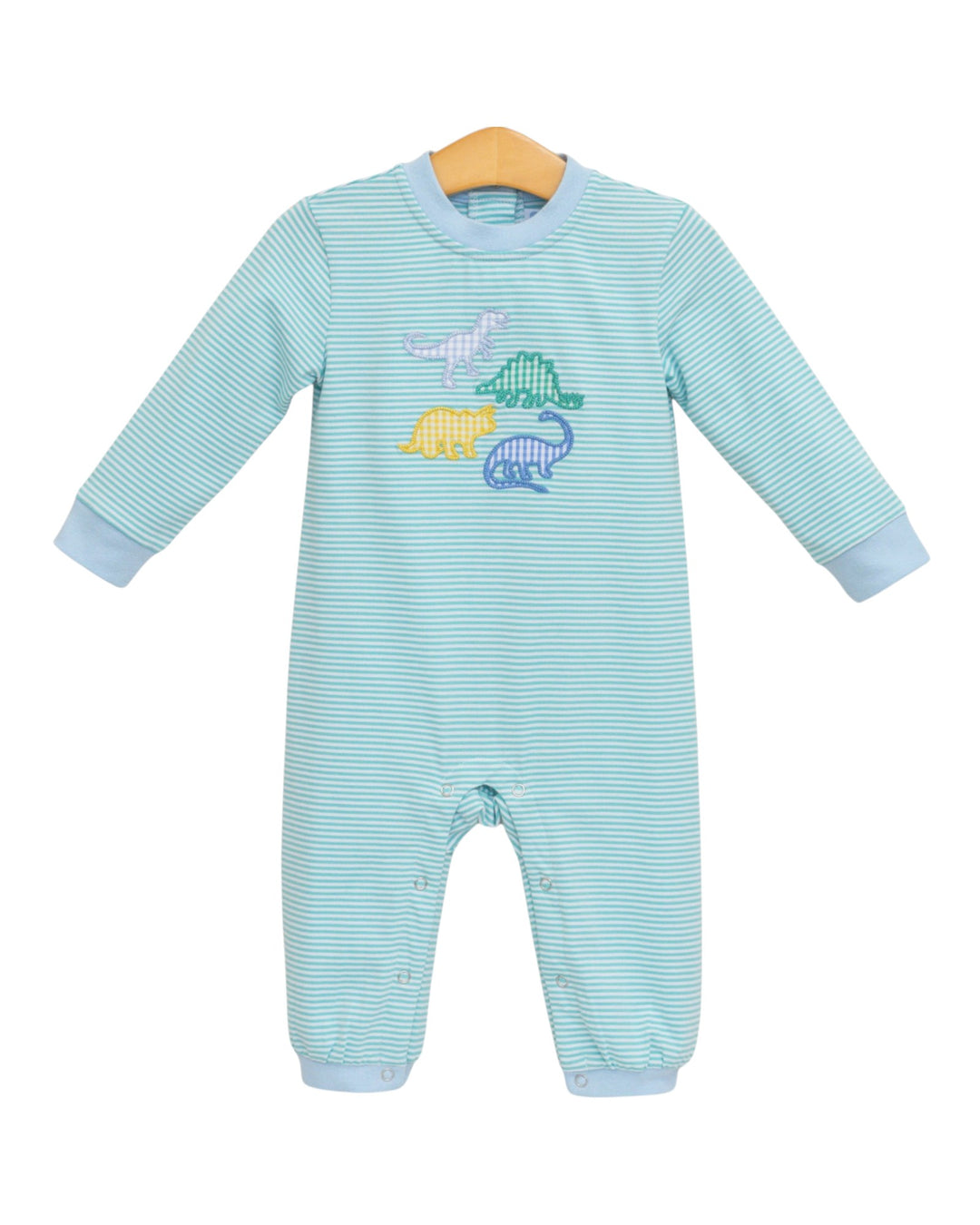 A baby long-sleeve footless one-piece jumpsuit in light blue and white stripes, featuring a colorful dinosaur graphic on the chest, hanging on a wooden hanger against a white background, that store