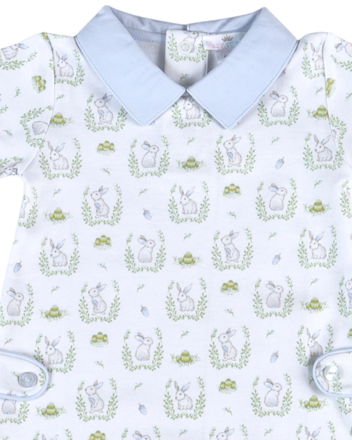 Children's shirt with bunny and carrot pattern on a light blue background
