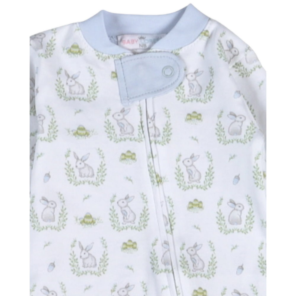 Baby onesie with bunny and flower pattern on a white background