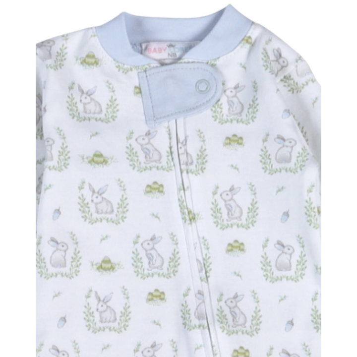 Baby onesie with bunny and flower pattern on a white background