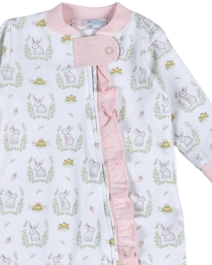 Baby outfit with bunny pattern and pink trim on a white background