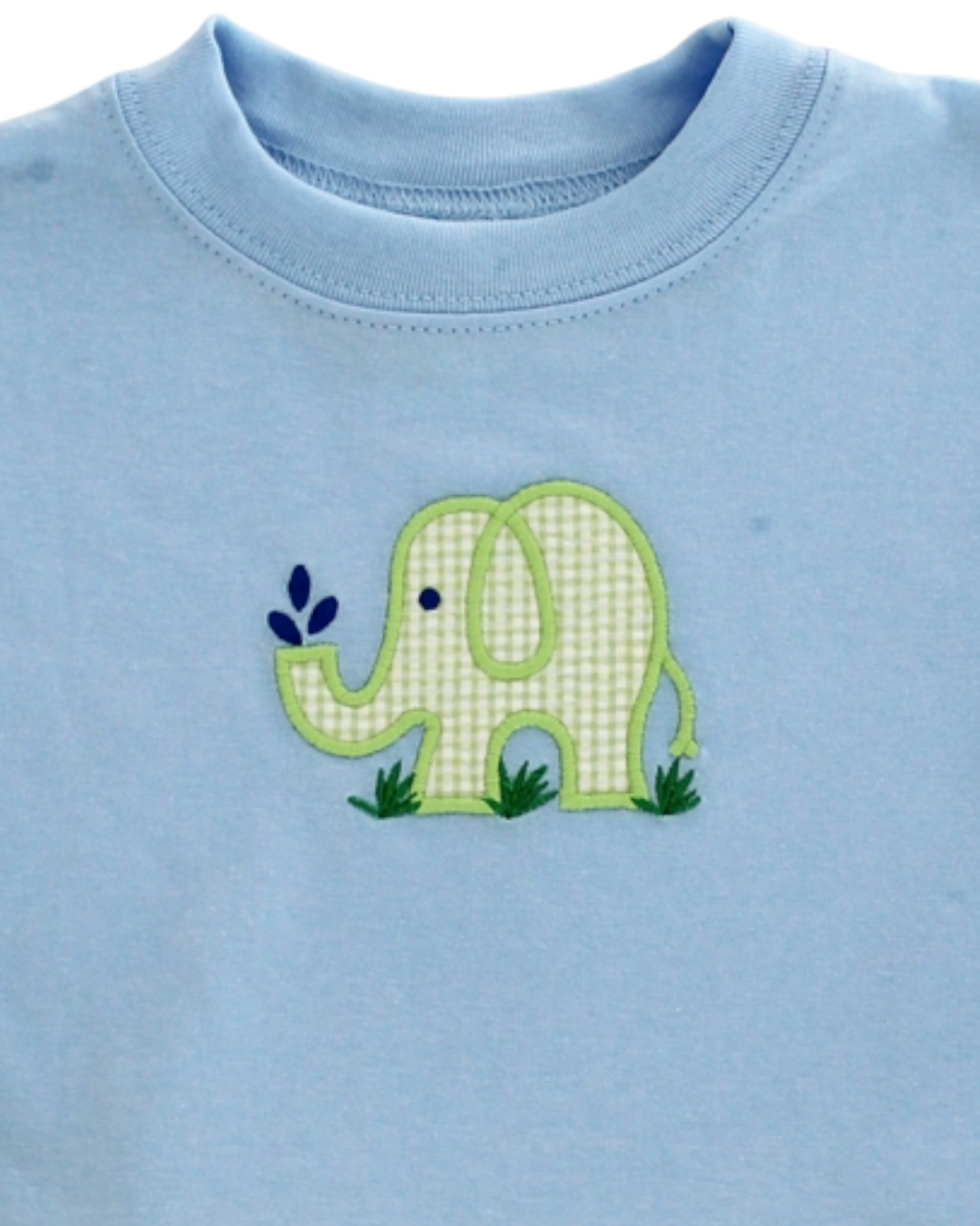 Blue shirt with a green elephant design on a plain background