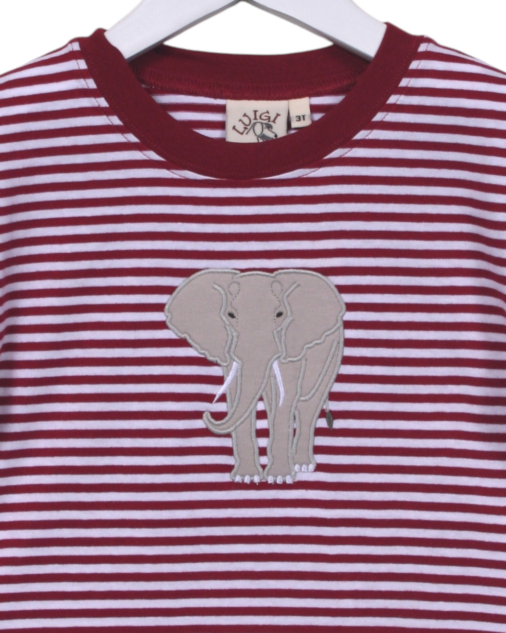 Red and white striped shirt with an elephant applique on a hanger