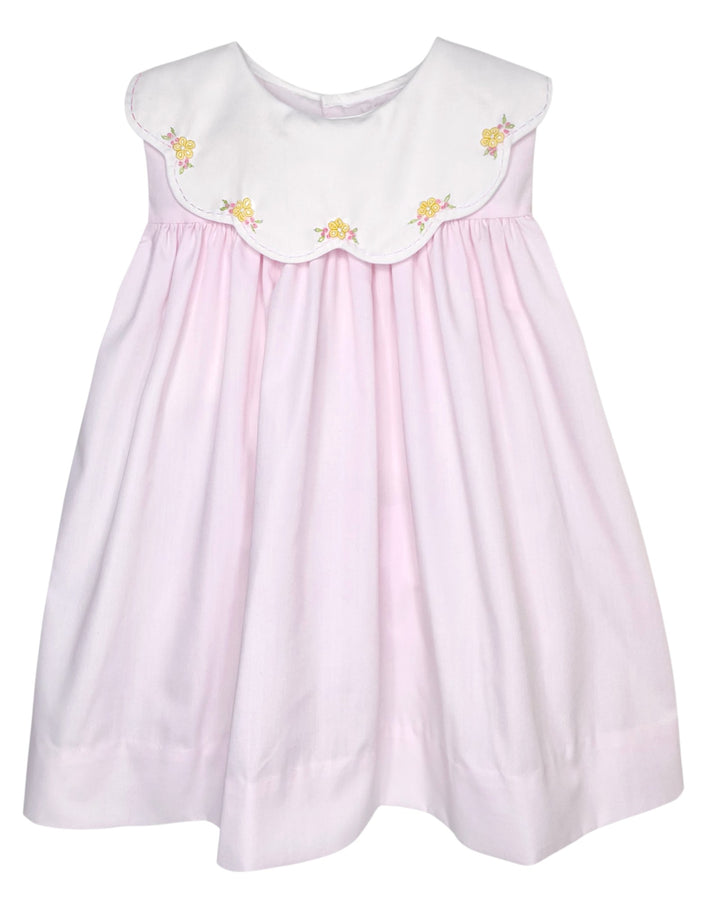 Pink dress with white collar featuring yellow floral embroidery on a white background