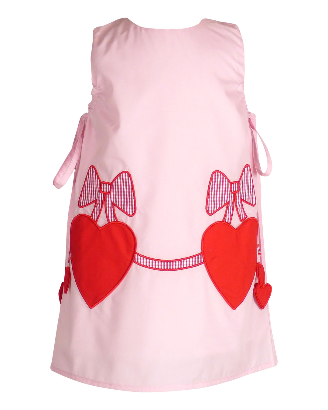 Pink dress with red hearts and bows on a white background