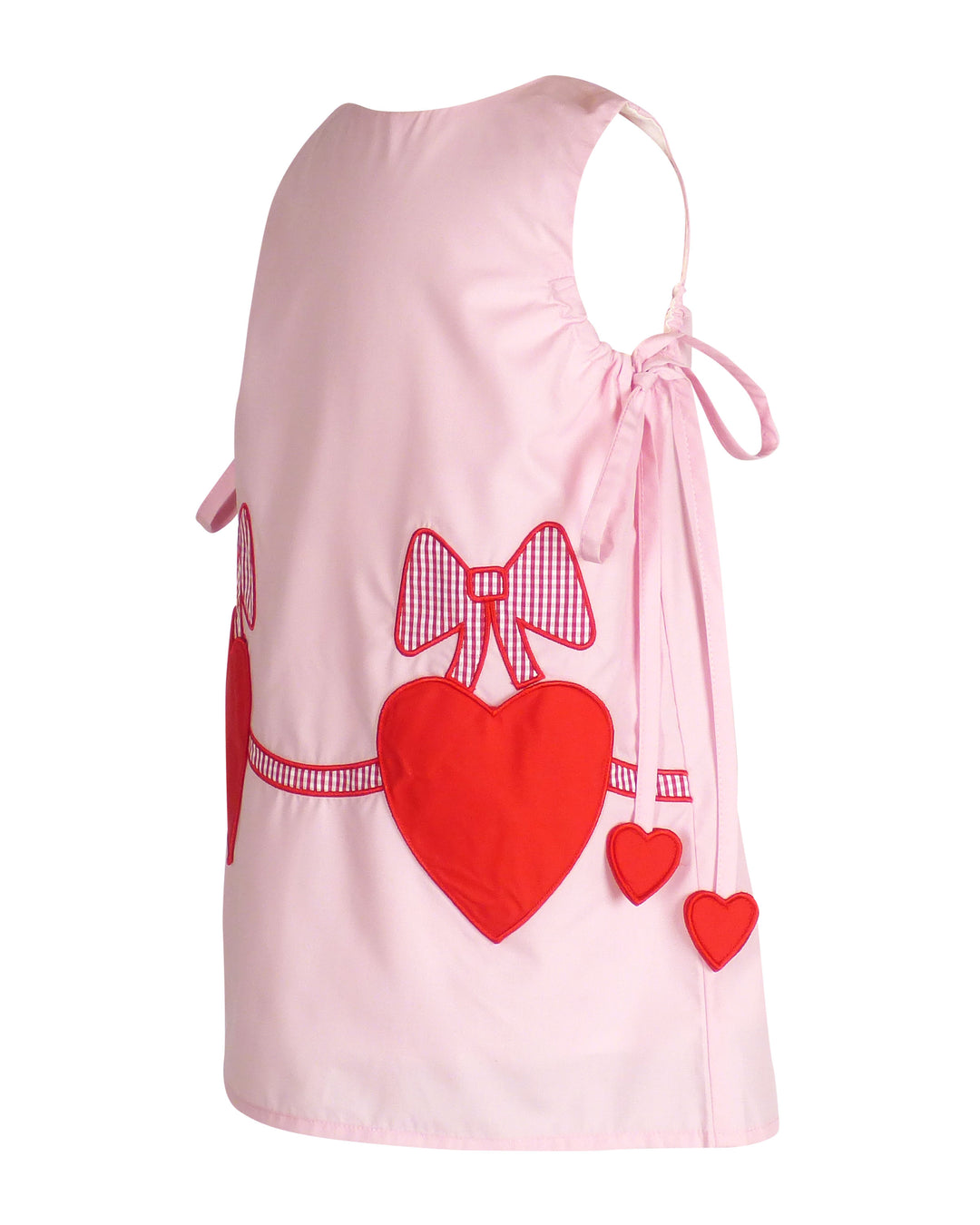 Pink dress with red hearts and bows on a white background