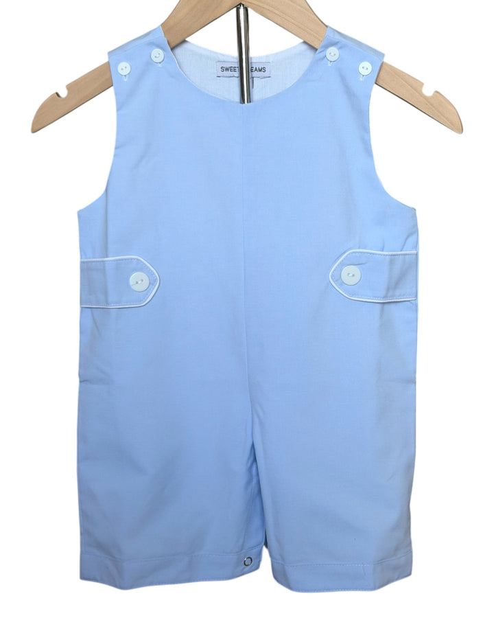 Light blue children's romper with button details on a hanger against a white background
