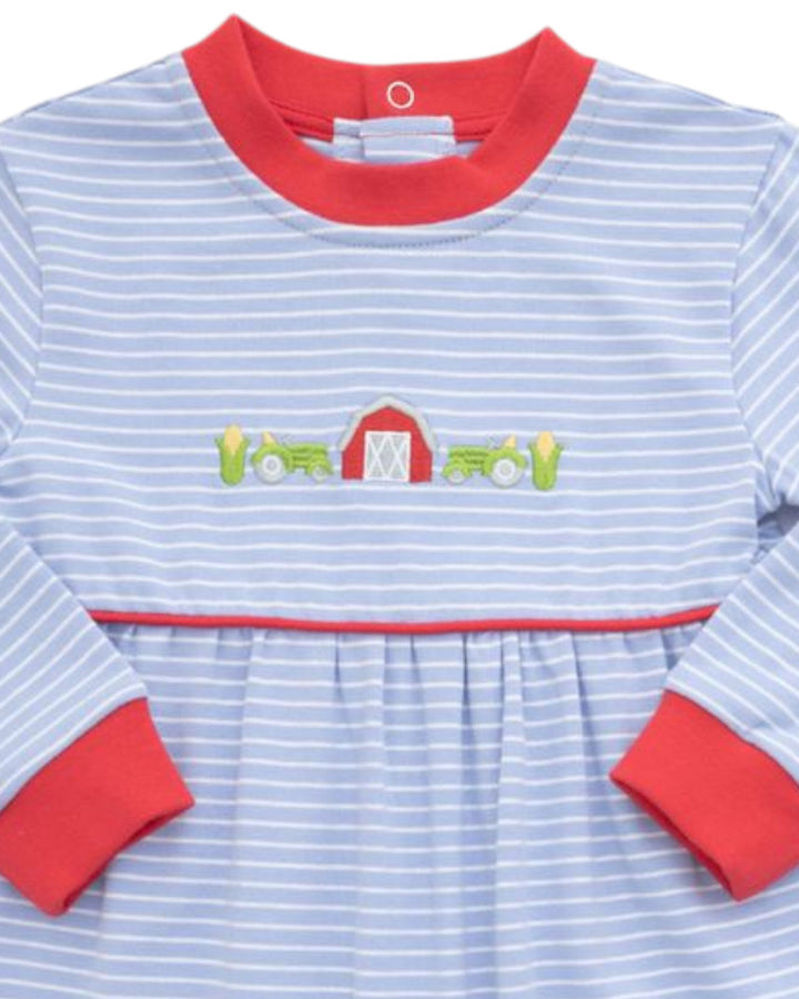 A baby long-sleeve dress with light blue and white horizontal stripes, featuring a red crew neck, red cuffs, and a central embroidered design of green tractors and a red barn, that store