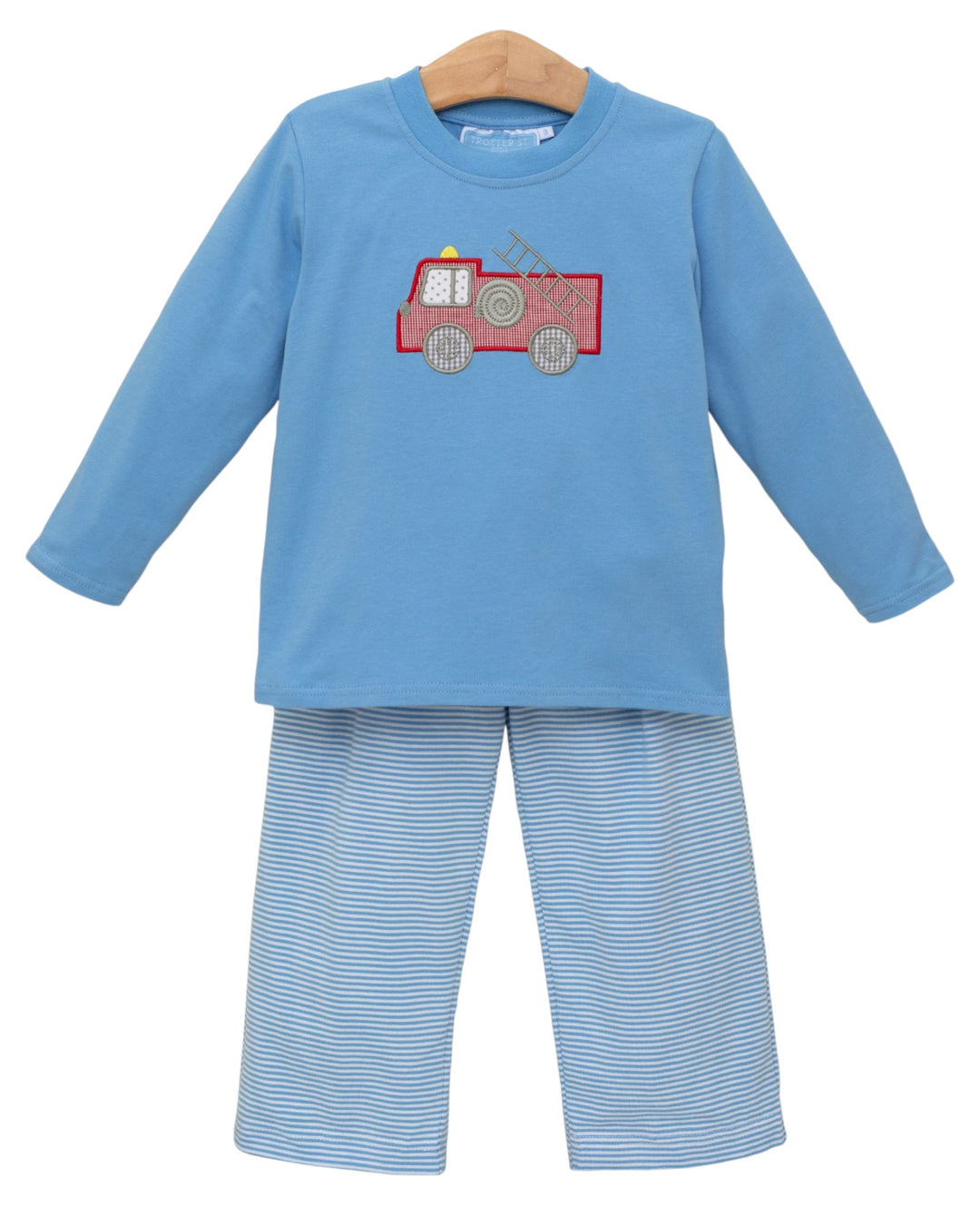 Children's blue outfit with a red fire truck design on a white background