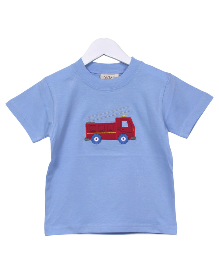 Blue t-shirt with a red fire truck design on a white background