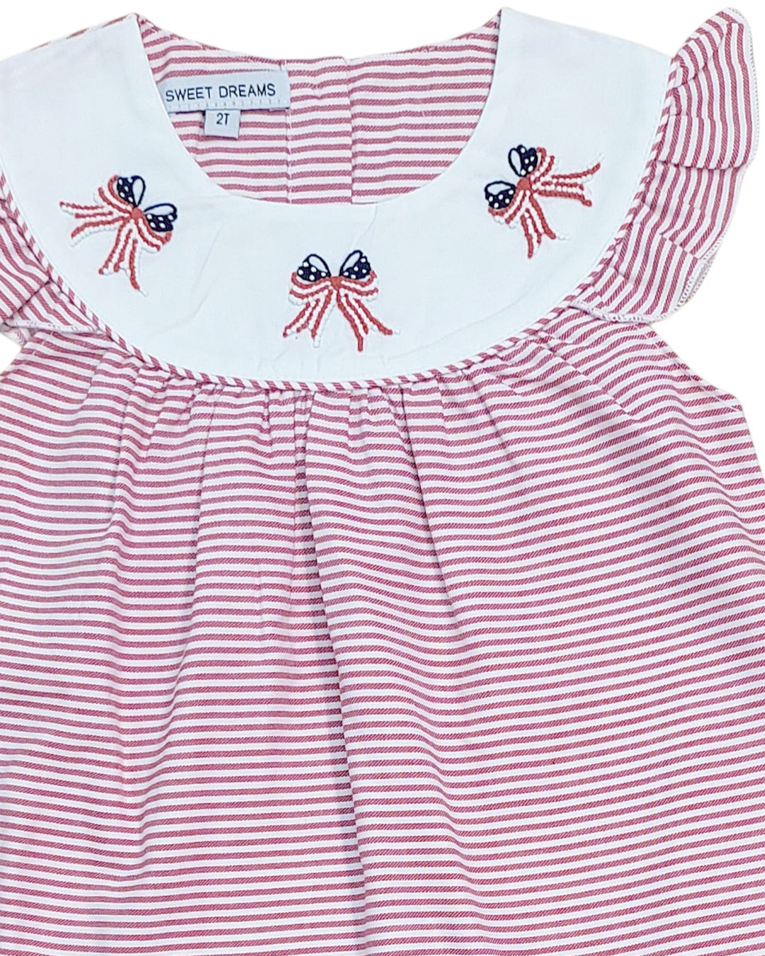 Red and white striped dress with embroidered details on a white background, that store