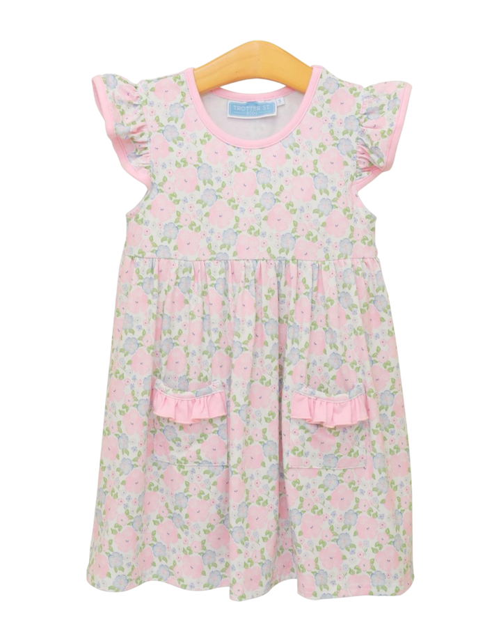 Floral dress with pink accents on a white background