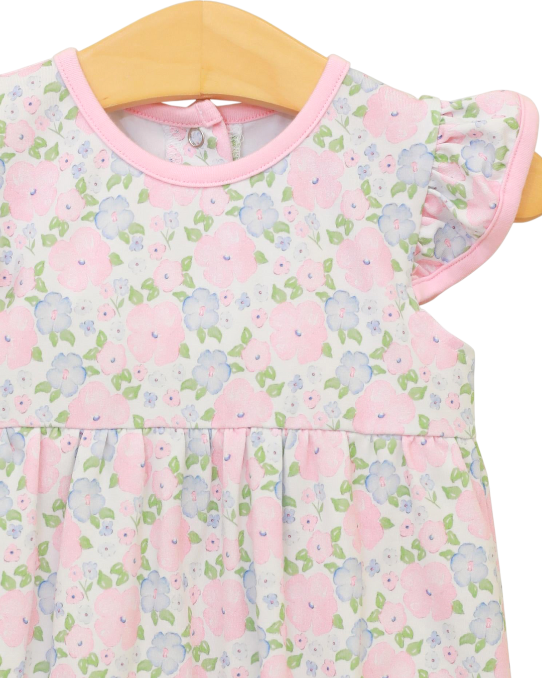 Floral dress on a hanger with pink trim