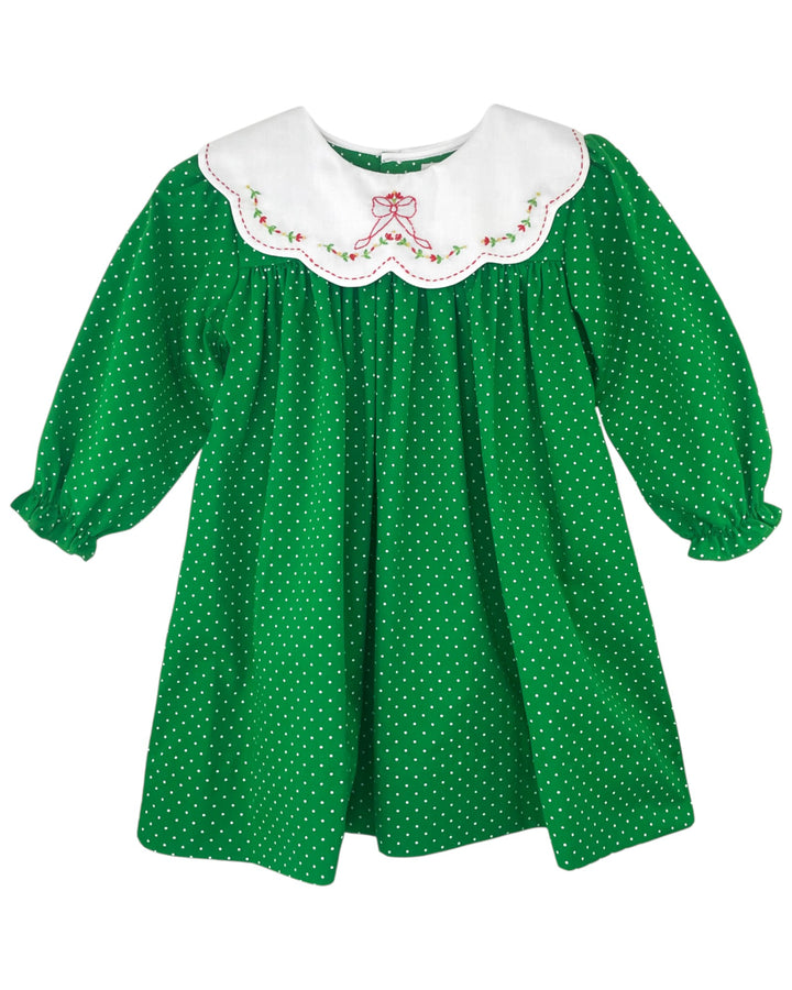 Green polka dot dress with white embroidered collar on a white background