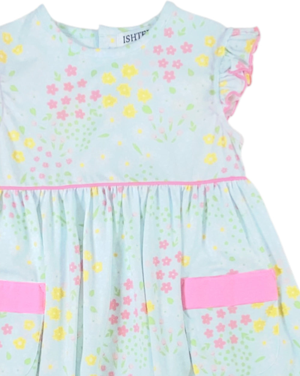 Children's dress with floral pattern and pink accents on a light blue background