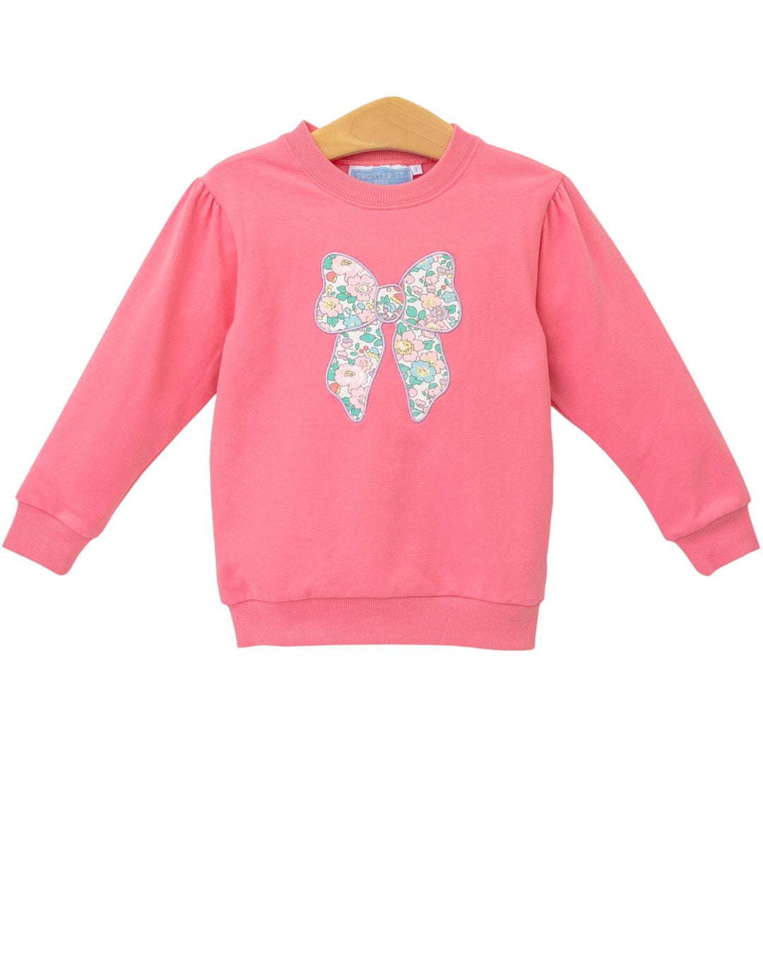 Pink sweatshirt with a colorful butterfly design on a white background