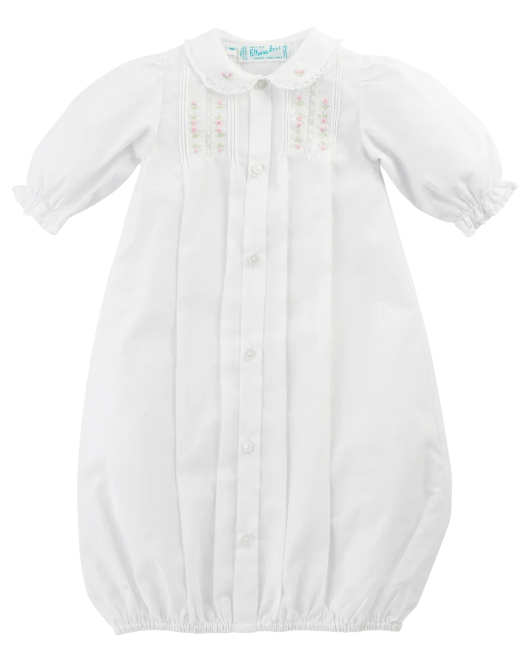 White baby gown with long sleeves on a white background