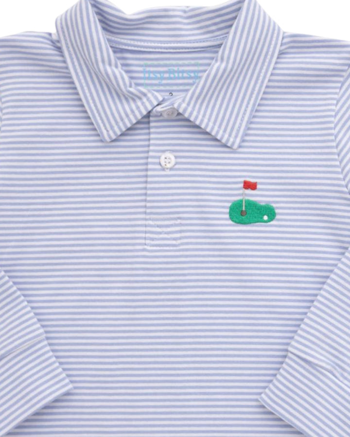 A close-up of a long-sleeve polo shirt with fine light blue and white horizontal stripes, featuring a small embroidered green golf hole graphic with a red flag on the left chest, that store