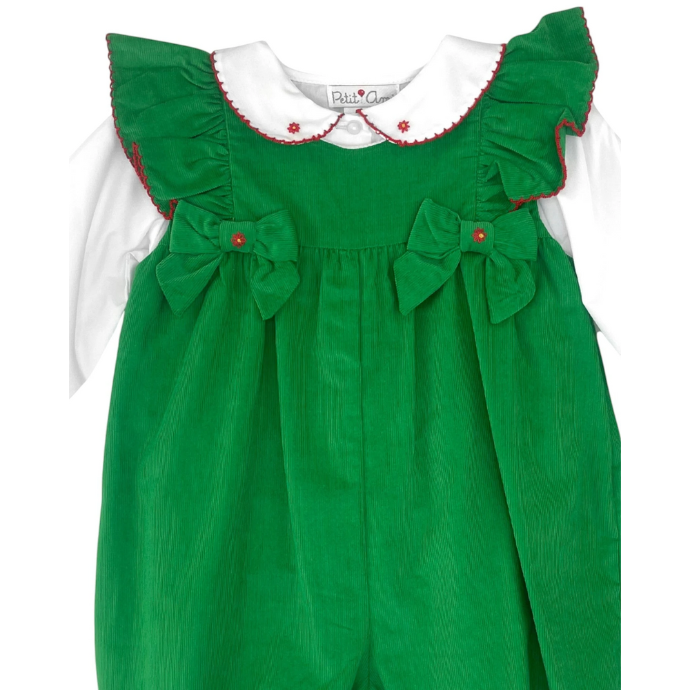 Green dress with white collar and red trim on a white background