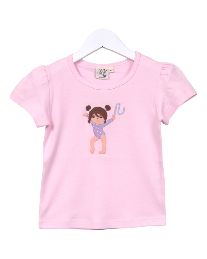 Pink t-shirt with a graphic of a girl in a leotard on a white background