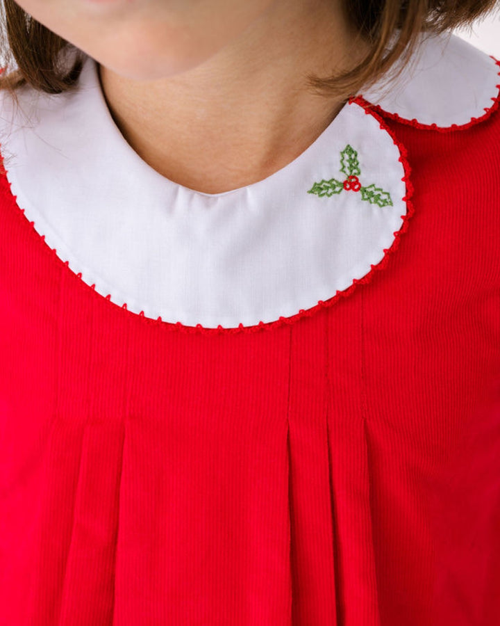 Red dress with a white collar featuring holly design