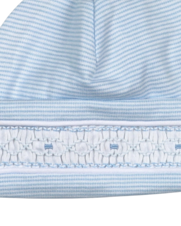 Close-up of a blue and white striped fabric with ruffled edge