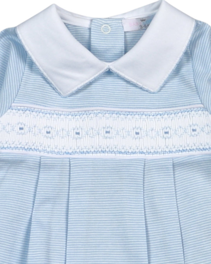 Light blue dress with white collar and lace details on a white background