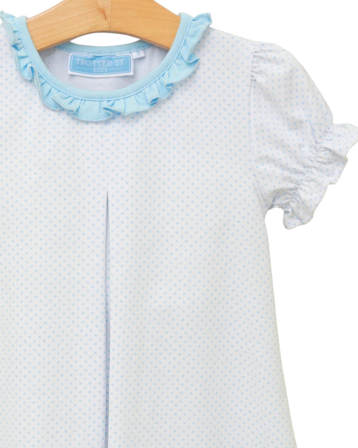 Baby dress with blue ruffled collar and trim on a hanger