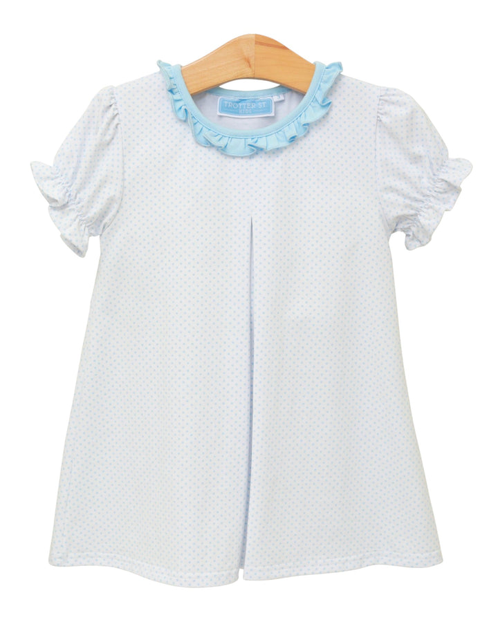 White baby dress with blue ruffled collar on a hanger against a white background
