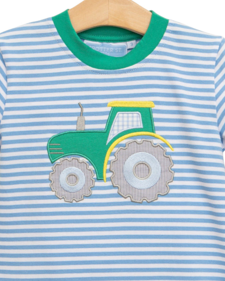 Children's shirt with a green tractor applique on a blue and white striped background