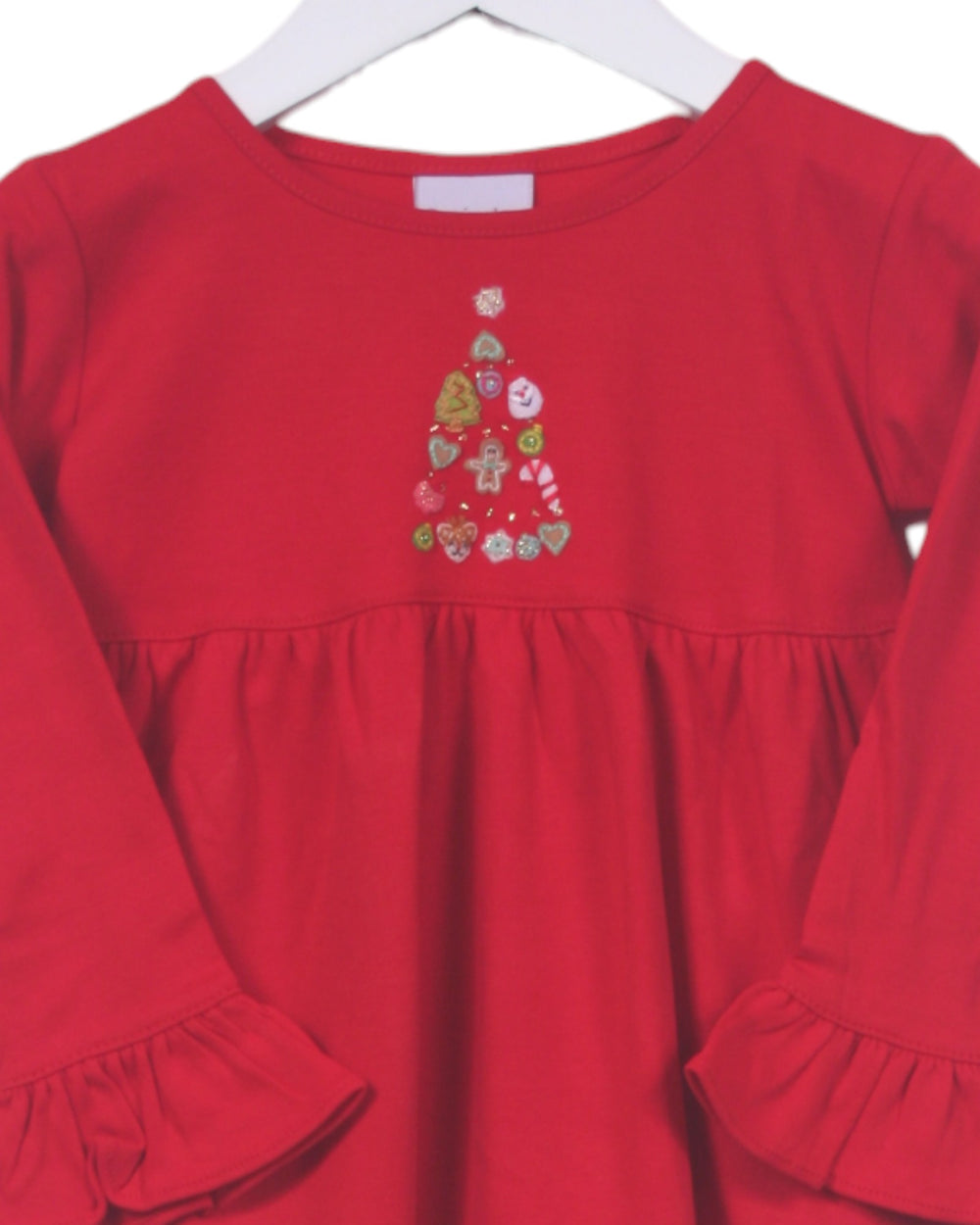 Red dress with a Christmas tree design on a white background