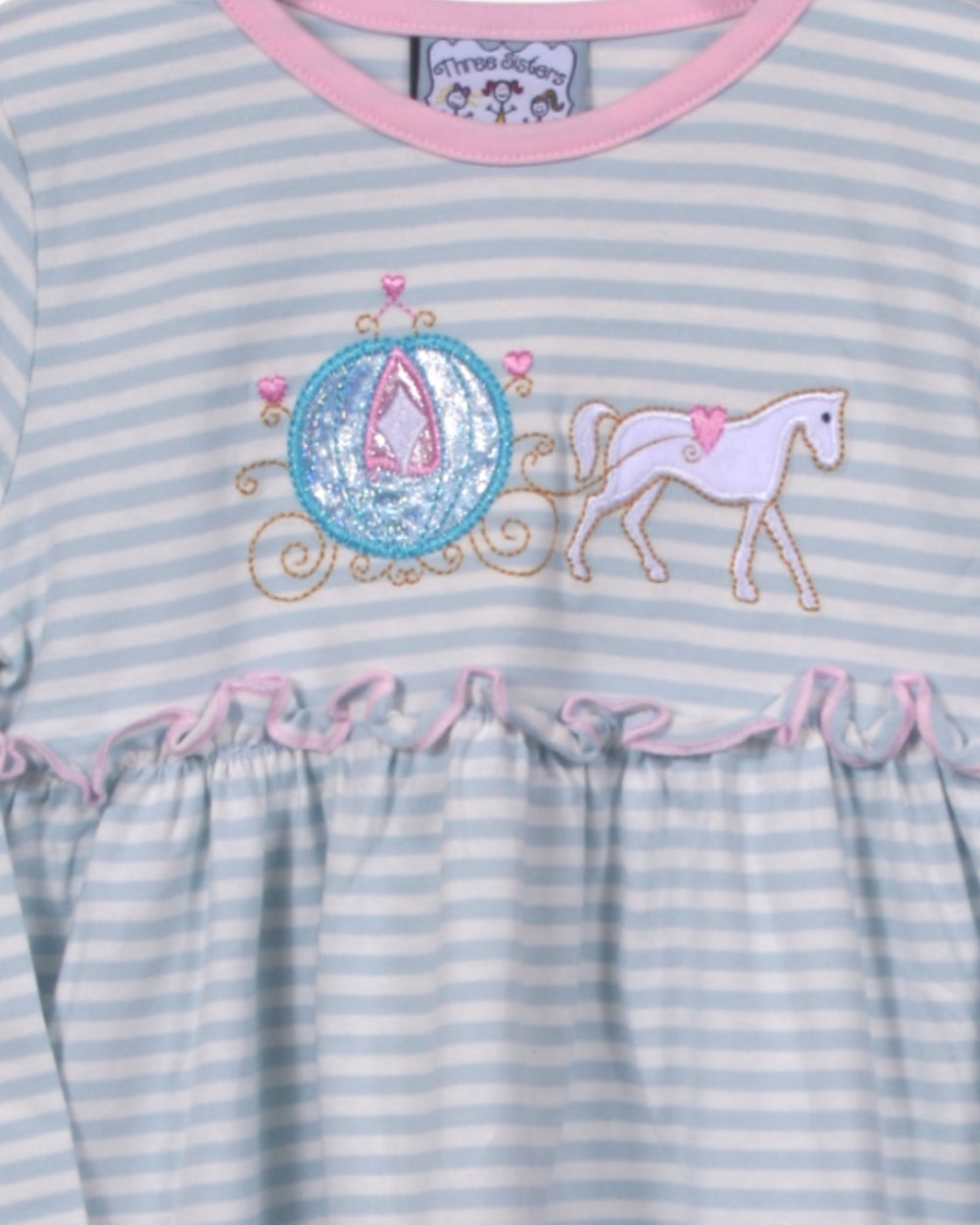 Children's dress with horse and carriage design on a striped background