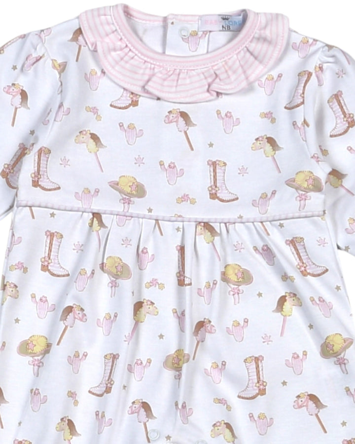 Children's dress with cowboy boot and hat pattern on a white background