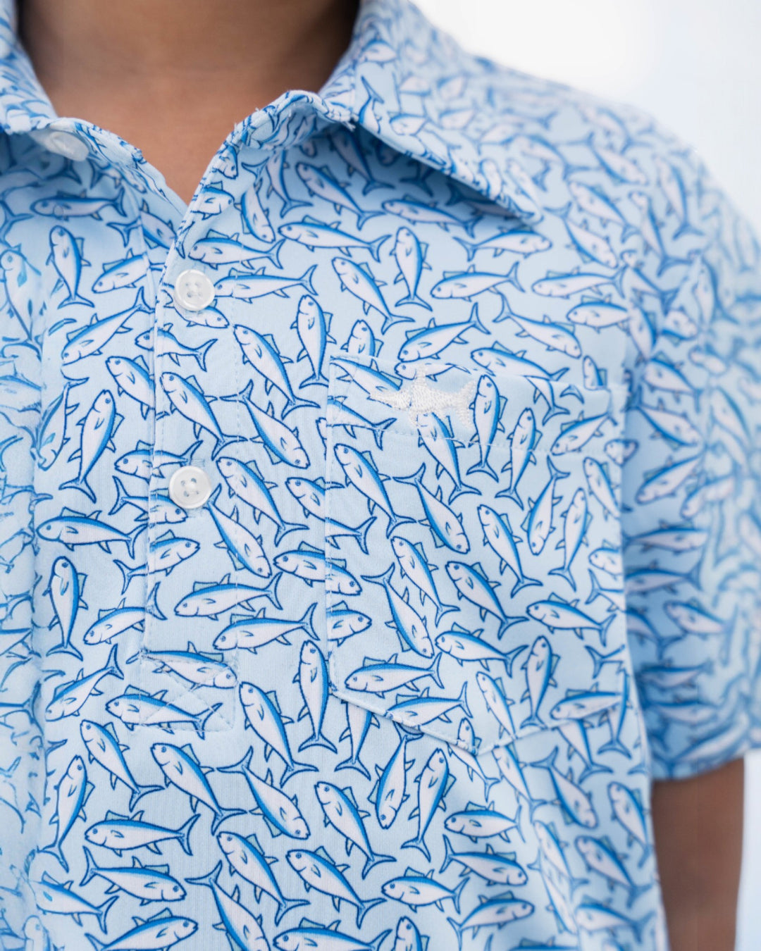 Close-up of a blue patterned shirt with fish design