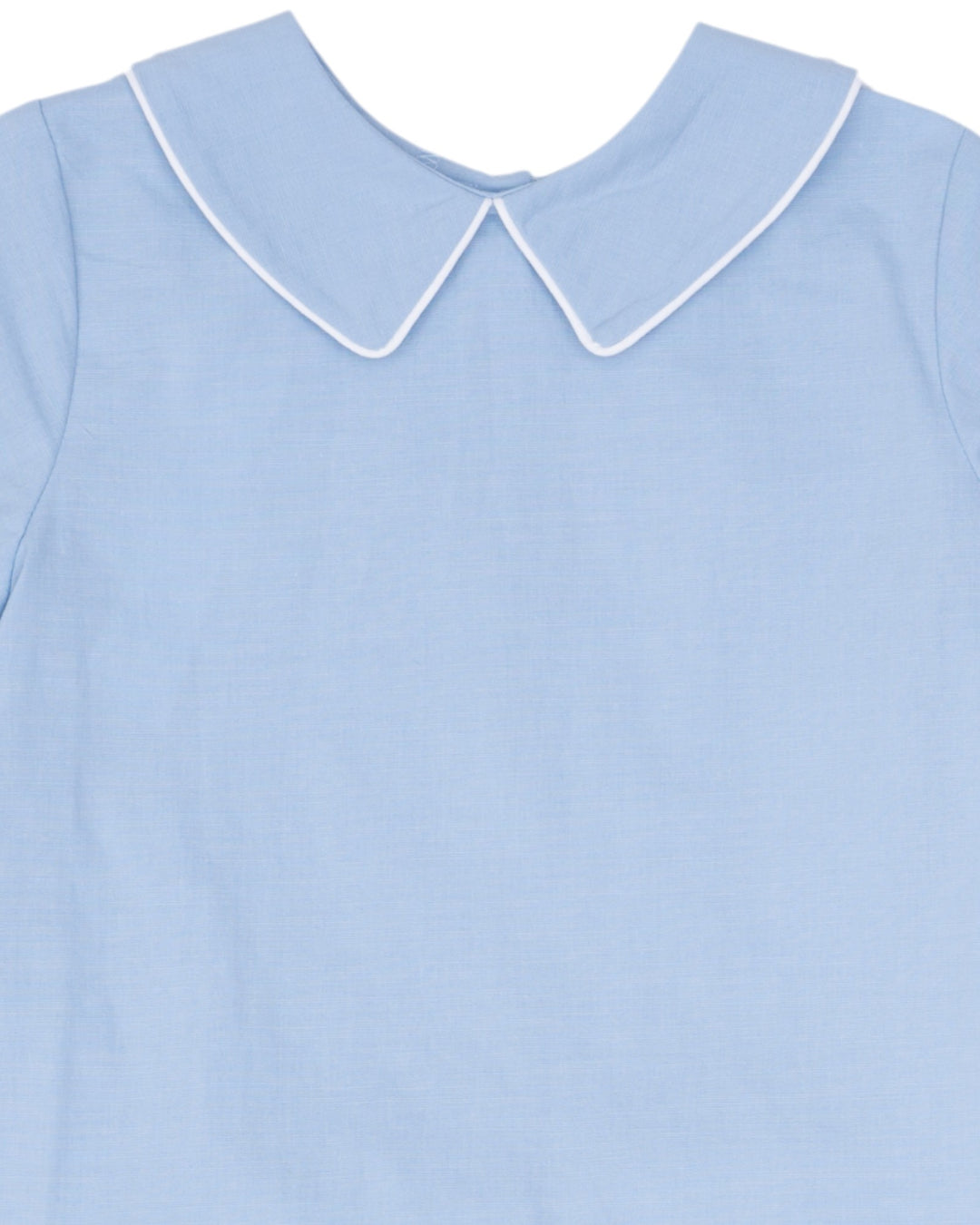 Light blue dress with a white collar on a plain background