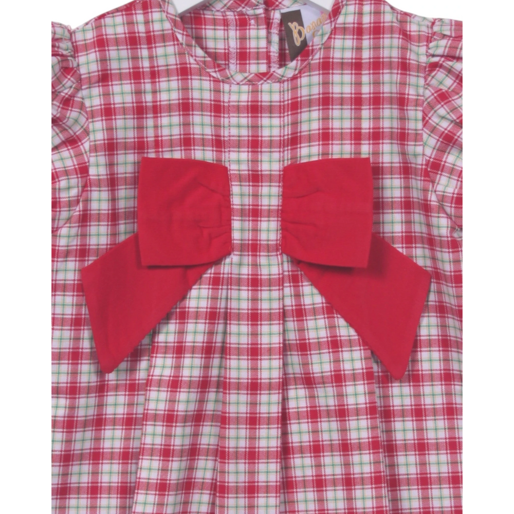 Red and green checkered dress with large red bows on a white background