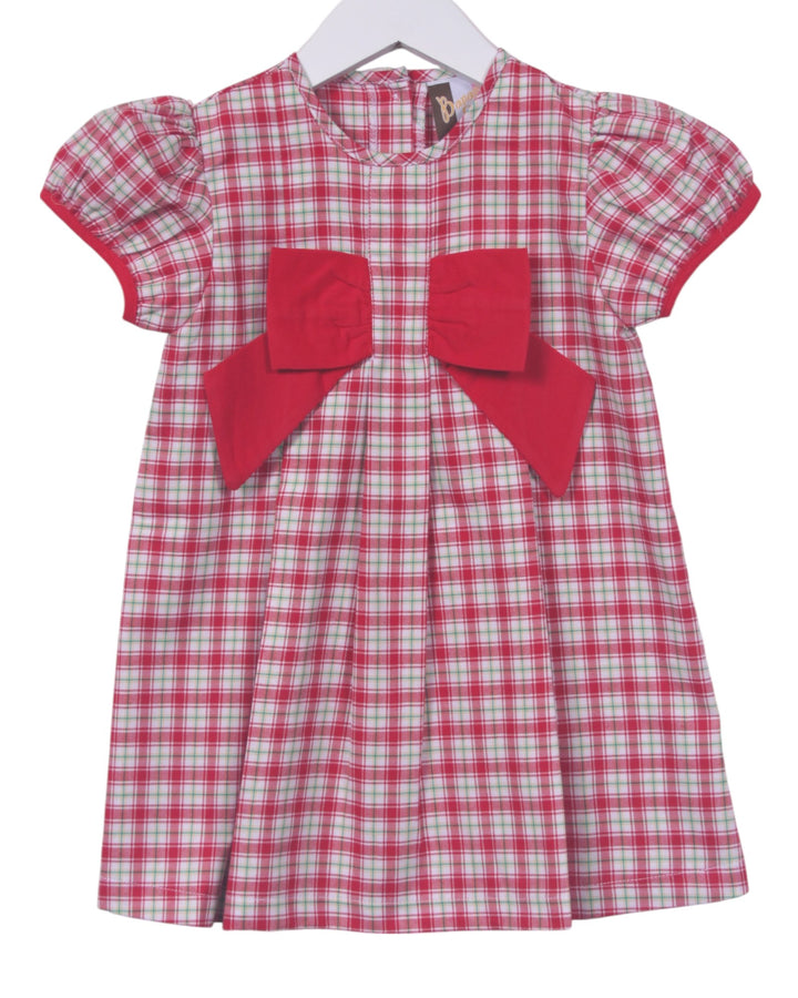 Red and white checkered dress with a large red bow on a white background