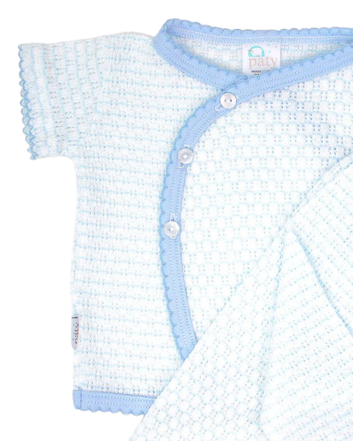 Baby knitted outfit with light blue trim on a white background